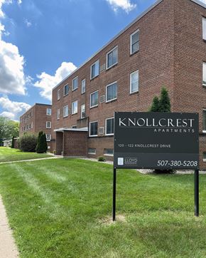 Mankato apartment for rent - Knollcrest Apartments is a brick building with a sign in front.