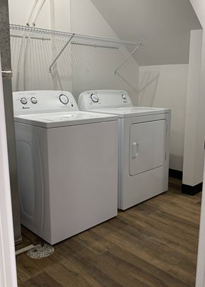 Eagle Lake townhouse for rent - a washer and dryer in a laundry room