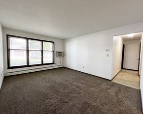 Mankato apartment for rent - an empty living room with a large window