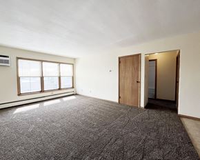 Mankato apartment for rent - an empty living room with a window and a door