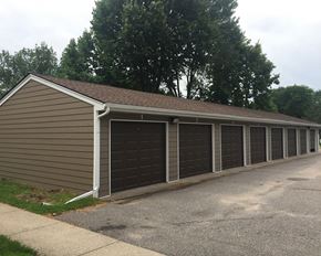 North Mankato townhouse for rent - A long building with a brown siding and a brown roof.