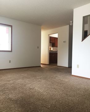 North Mankato townhouse for rent - A room with a carpeted floor and a doorway leading to another room.