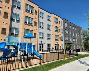 St. Louis Park apartment for rent - a playground in front of an apartment building