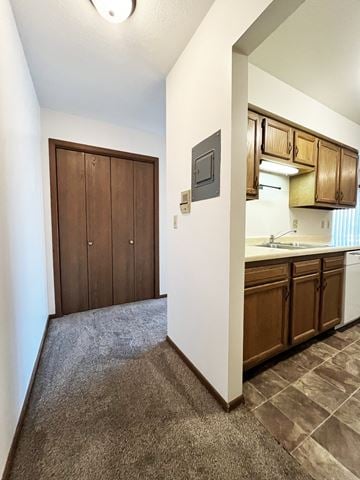 North Mankato apartment for rent - A kitchen with brown cabinets and a white wall.