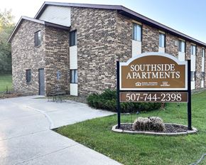Lonsdale apartment for rent - A sign for Southside Apartments is in front of a brick building.