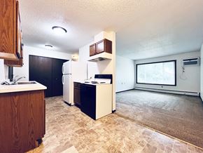 Windom apartment for rent - A kitchen with a refrigerator, oven, and microwave.