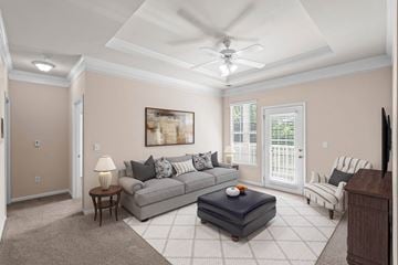 Overland Park apartment for rent - a living room with a couch and a ceiling fan