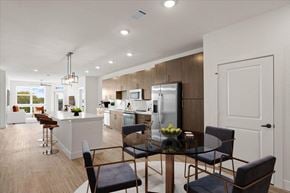 Overland Park apartment for rent - an open kitchen and dining room with a table and chairs