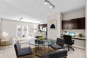 Lenexa townhouse for rent - a living room and dining room with a glass table
