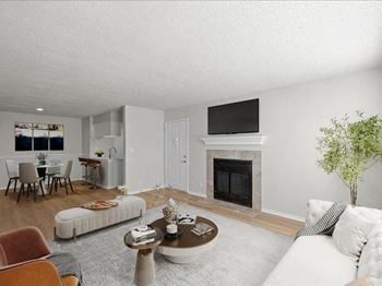 A living room with a fireplace and a couch