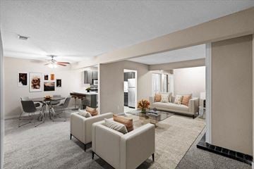 Overland Park apartment for rent - a living room with a couch and a table