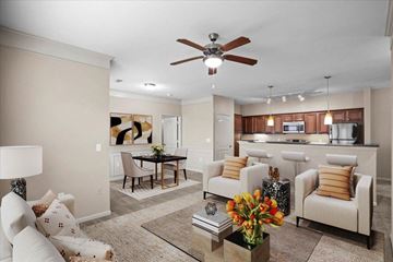 Overland Park apartment for rent - a living room with furniture and a ceiling fan