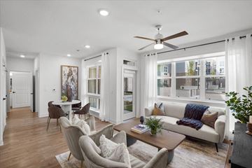 Overland Park apartment for rent - a living room with furniture and a ceiling fan