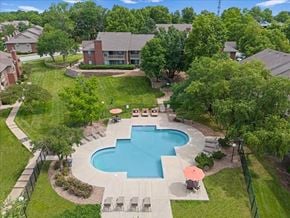 Overland Park apartment for rent - an aerial view of a swimming pool in the backyard of a house at Highland Park Apartment Homes, Overland Park