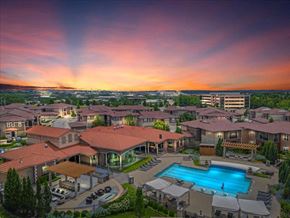 Overland Park apartment for rent - an aerial view of a resort with a swimming pool at Sorrento at Deer Creek Apartment Homes, Overland Park, Kansas