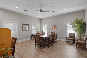 Olathe apartment for rent - a dining room with a table and chairs and a ceiling fan at Somerset Oaks Apartment Homes, Olathe 66062