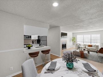 Overland Park apartment for rent - a kitchen and living room with a table and chairs