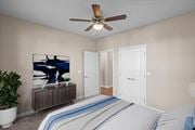 Kansas City apartment for rent - a bedroom with a bed and a ceiling fan at The Dorset, Kansas City, 64112