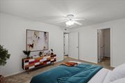 Olathe apartment for rent - a bedroom with a bed and a ceiling fanat Millcreek Woods Apartments, Olathe, Kansas