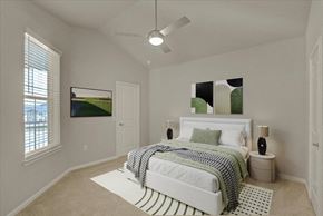Denton apartment for rent - a bedroom with a bed and a ceiling fan