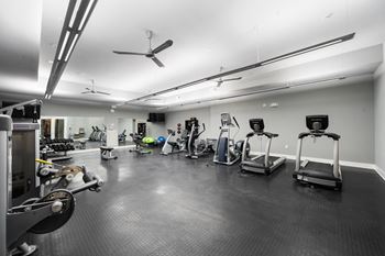 Fitness center with cardio and free weights at west 39th street apartments