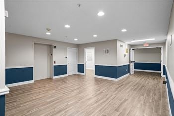 A spacious room with wooden flooring