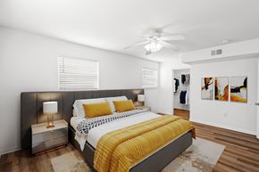 Kansas City apartment for rent - A bedroom with windows, a ceiling fan, and a walk in bedroom closet at Malvern Hill Apartment Homes, 66103, KS