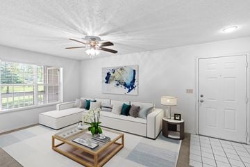 Overland Park apartment for rent - a living room with a couch and a coffee table
