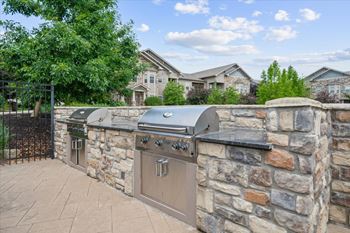 A stone wall with a grill on top.
