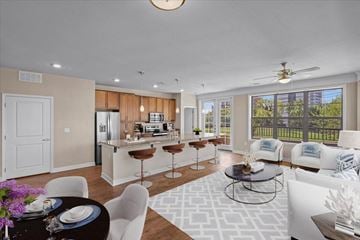 Kansas City apartment for rent - a living room and a kitchen with a table and chairs