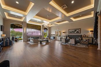 A large living room with furniture and a large window