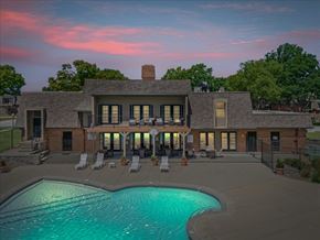 Overland Park apartment for rent - House with a pool in front of it at Louisburg Square Apartments & Townhomes, Overland Park, KS