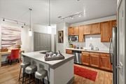 Lewisville apartment for rent - Kitchen with wooden cabinets at Ovation at Lewisville, Lewisville