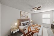 Kansas City apartment for rent - Bedroom with ceiling fan at Cloverset Active Adult Apartments, Kansas City, 64114