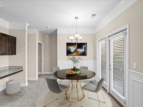 Overland Park apartment for rent - a dining room with a table and chairs at Sorrento at Deer Creek Apartment Homes, Overland Park