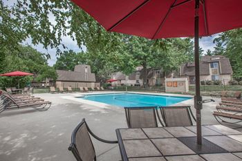 A lounge area with an umbrella