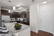 Kansas City apartment for rent - a kitchen with a counter top with a bowl of fruit at West 39th Street Apartments, Kansas City, 64111