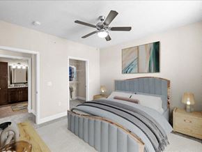Overland Park apartment for rent - a bedroom with a bed and a ceiling fan at Sorrento at Deer Creek Apartment Homes, Overland Park, KS, 66213