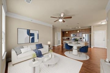 Overland Park apartment for rent - A living room with a white couch and a painting on the wall.
