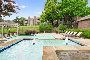 Overland Park apartment for rent - A pool with a waterfall in the middle of it. at Coventry Oaks Apartments, Overland Park