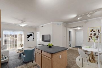 Olathe apartment for rent - our apartments offer a living room and dining room with a tv