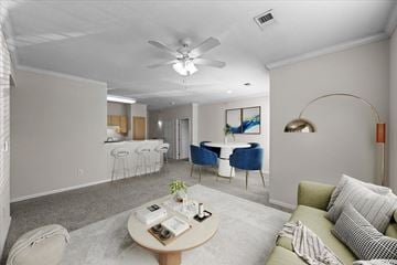 Overland Park apartment for rent - A living room with a grey carpet and a white ceiling fan.