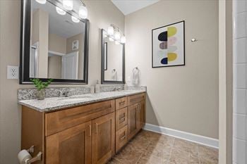 A bathroom with a sink and a mirror