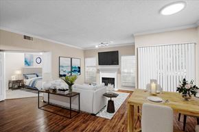 Dallas apartment for rent - a living room with a couch a table and a fireplace at Creekview Apartment Homes, Texas, 75254
