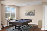 Lenexa townhouse for rent - a game room with a pool table and a bike on the wall at Prairie Creek Apartments & Townhomes Apartments, Lenexa, KS, 66219