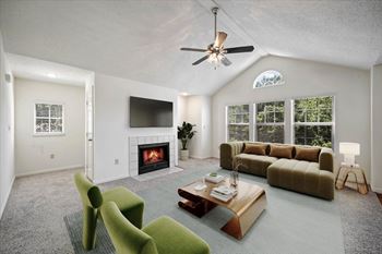 Living room with fireplace at stonebriar apartments