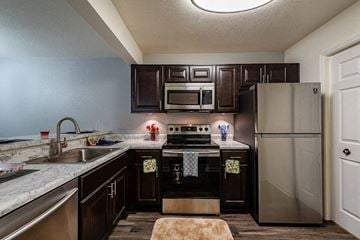 Goose Creek apartment for rent - a kitchen with stainless steel appliances and granite counter tops