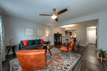 Rock Hill apartment for rent - A living room with a grey couch and a brown chair.