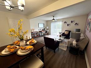 Goose Creek apartment for rent - A dining room with a table set for four and a couch.
