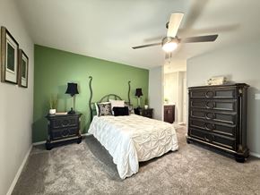 Rock Hill apartment for rent - A bedroom with a bed, dresser, and nightstand.